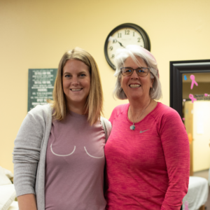 Jenna, a breast cancer previvor, posing for a photo with her breast surgeon, Dr. Anna Seydel at Sport & Spine Physical Therapy in Marshfield, WI.